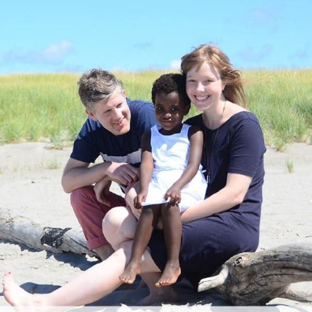 Child Adoption - white woman with African kid